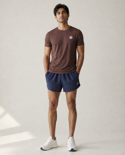 Athleia Sprintlite Shorts Navy with Pro Tee Brown – worn by a man