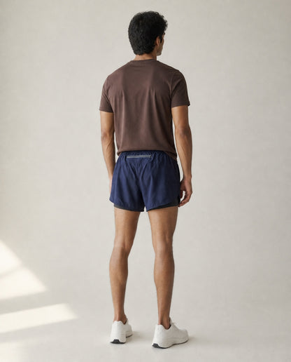 Athleia Sprintlite Shorts Navy with Pro Tee Brown, back view – worn by a man