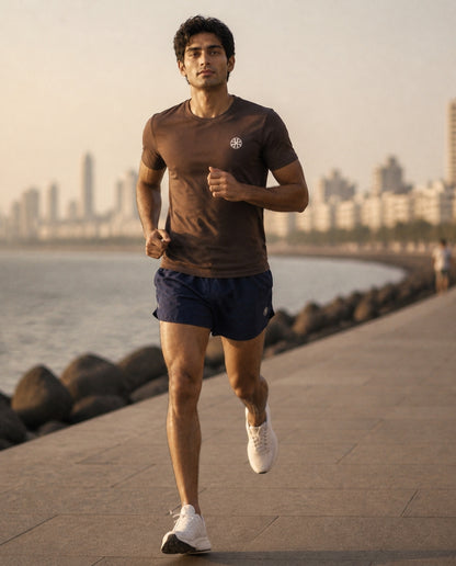 Athleia Sprintlite Shorts with Pro Tee Brown, running on Marine Drive – worn by a man