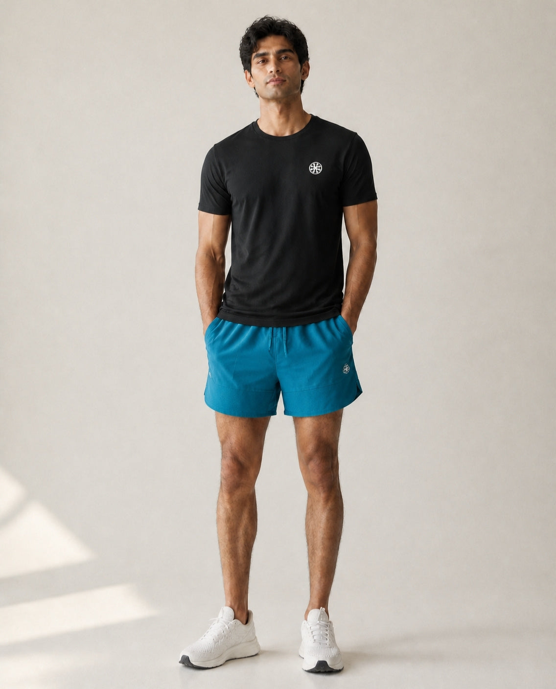 Athleia Apex Shorts Sea Green with Flow Tee Black – worn by a man