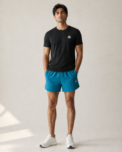 Athleia Apex Shorts Sea Green with Flow Tee Black – worn by a man
