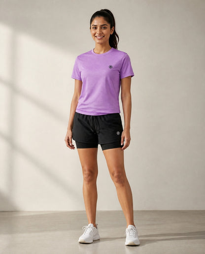 Athleia Aeroform Lined Shorts with Breathe Top Lilac – worn by a woman