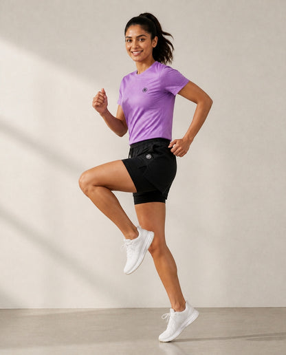 Athleia Aeroform Lined Shorts with Breathe Top Lilac, side view – worn by a woman