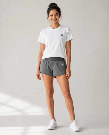 Athleia Arc Mini Shorts with Breathe Top Silver – worn by a woman