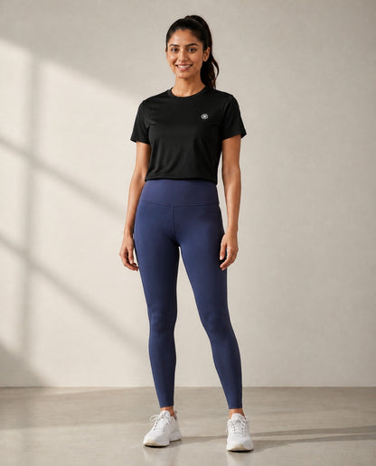 Athleia Flow Tee Black with Elevate Leggings Royal Blue – worn by a woman