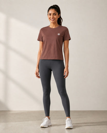 Athleia Pro Tee Brown with Infinite Leggings Graphite – worn by a woman