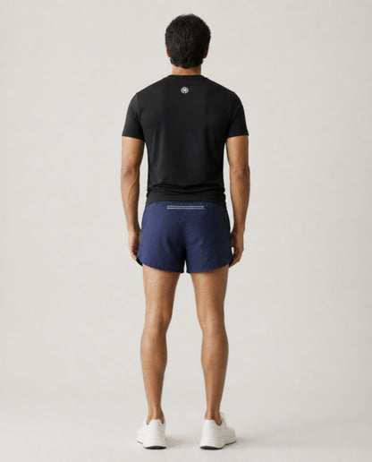 Athleia catalogue shoot – sprintlite shorts navy – back – worn by a man