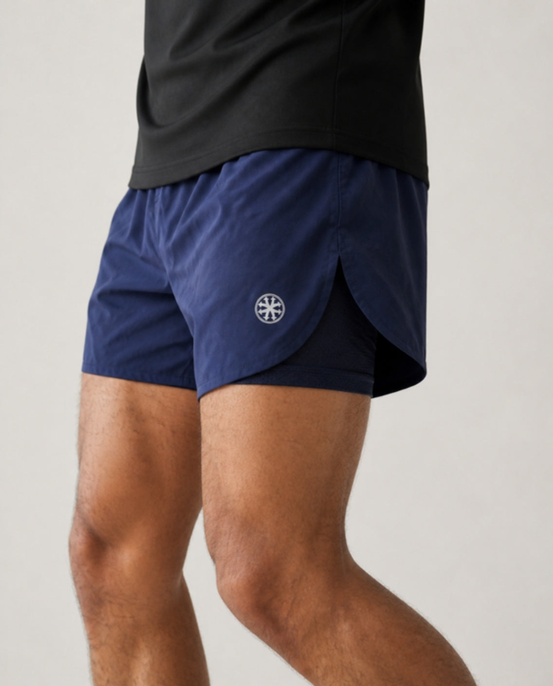 Athleia catalogue shoot – sprintlite shorts navy – detail – worn by a man