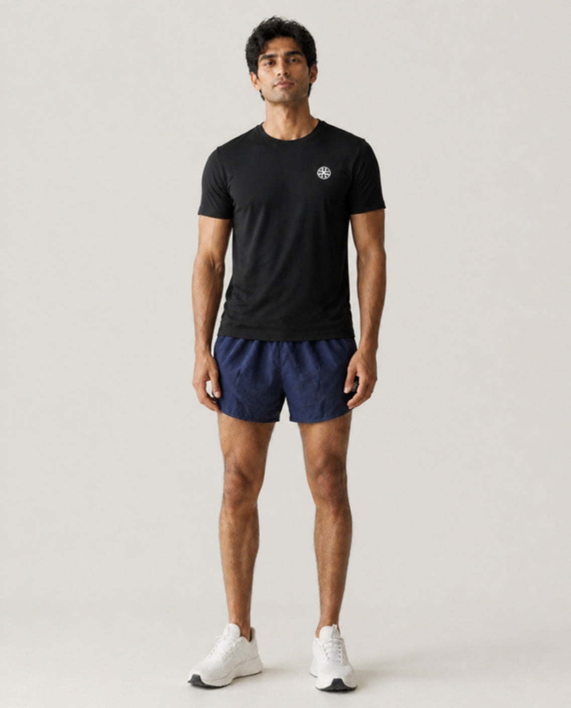 Athleia catalogue shoot – sprintlite shorts navy – front – worn by a man