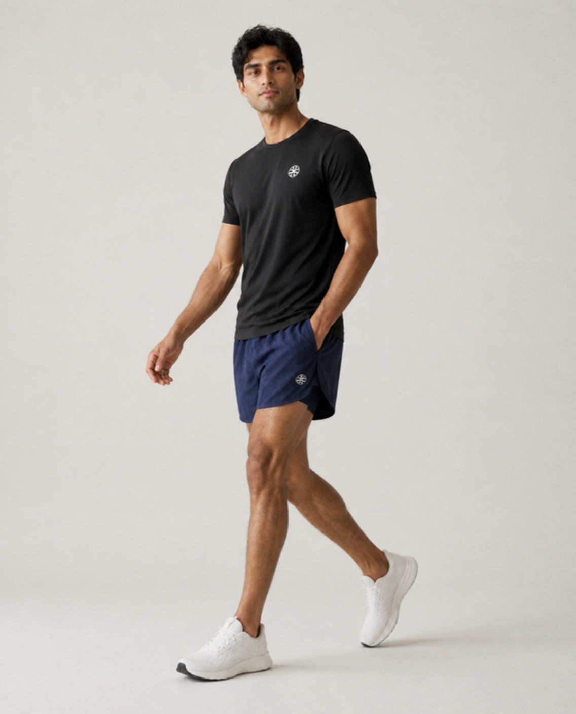 Athleia catalogue shoot – sprintlite shorts navy – side – worn by a man