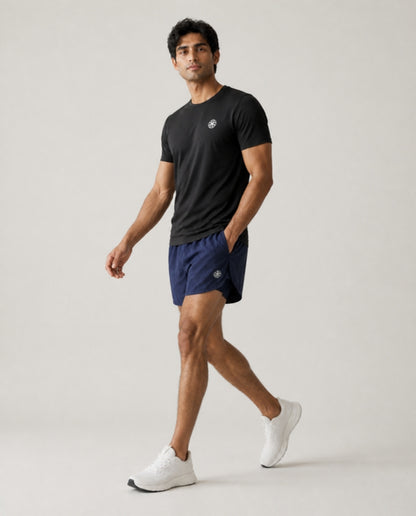 Athleia catalogue shoot – sprintlite shorts navy – side – worn by a man